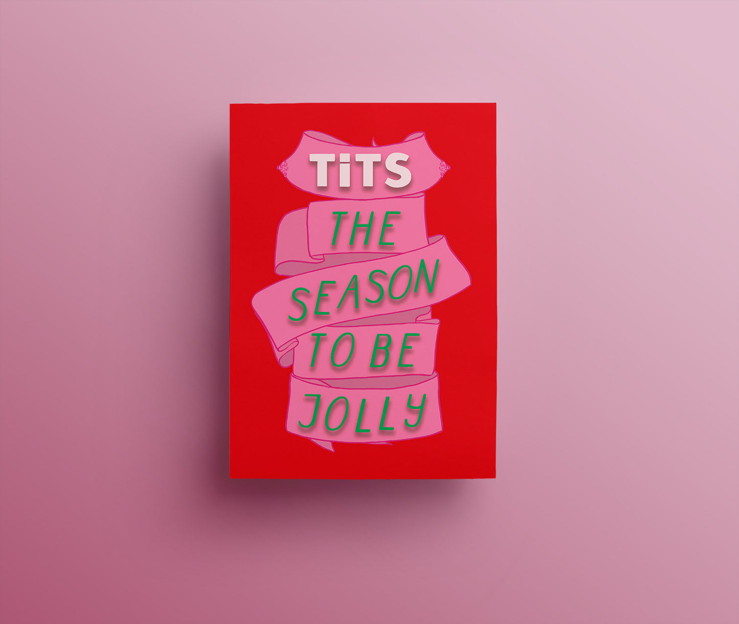 A red christmas card with a pink ribbon and beautifully festively decorated green words saying "tits the season" one section of the ribbon has a lovely pair of illustrated breasts with very pink, sparkly nipples.