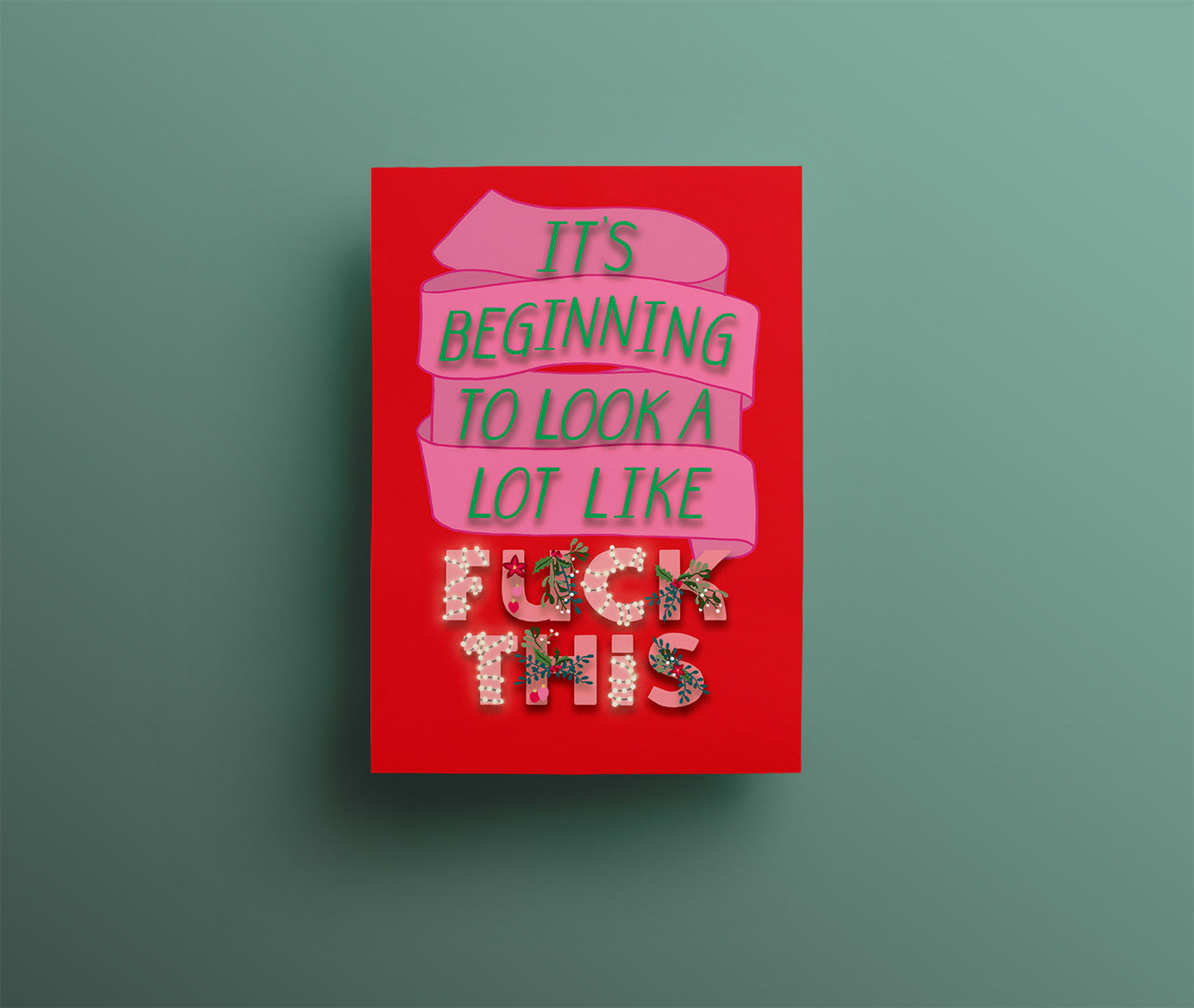 A red christmas card with a pink ribbon and beautifully festively decorated green and pink words saying "it's beginning to look a lot like fuck this"