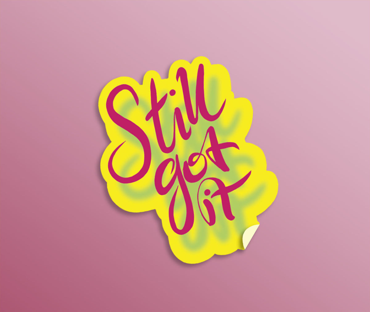 Bright yellow and bright pink hand drawn lettering die-cut sticker saying 'Still Got It.'