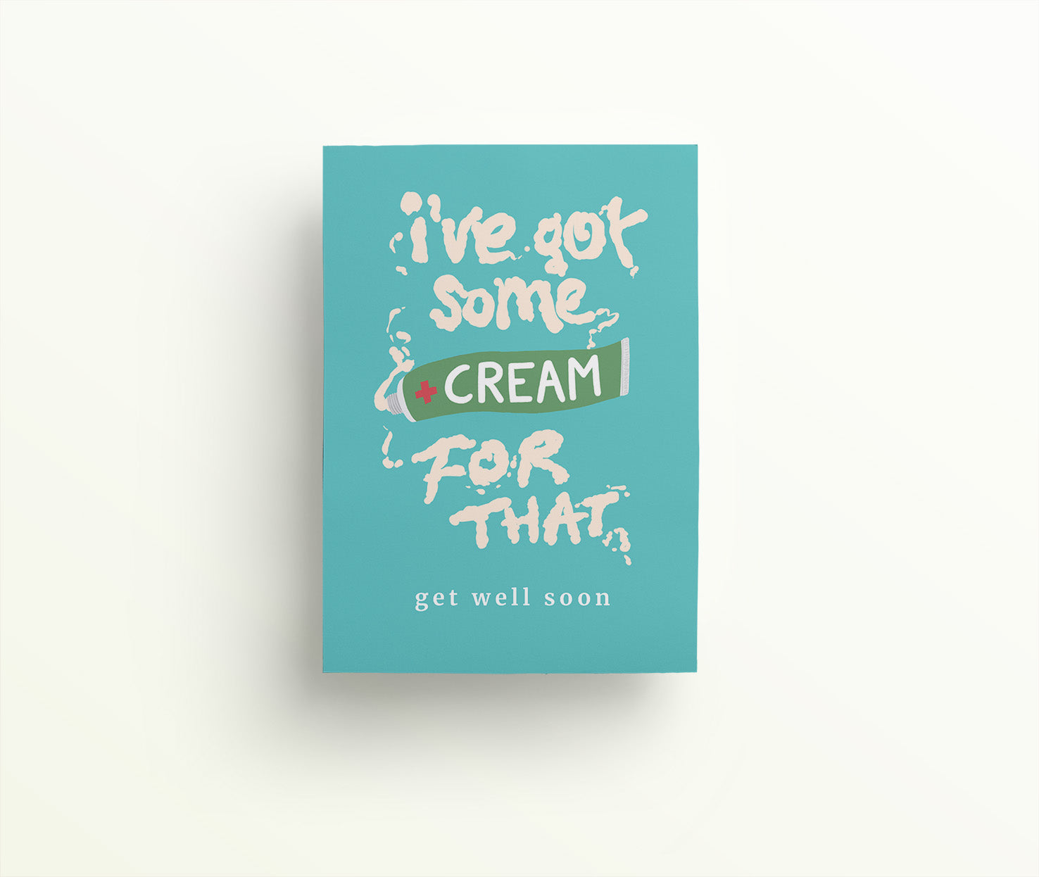 Turquoise greetings card with a tube of cream that has spurted and spelled out 'I've got some cream for that. Get well soon.' in white antiseptic cream.